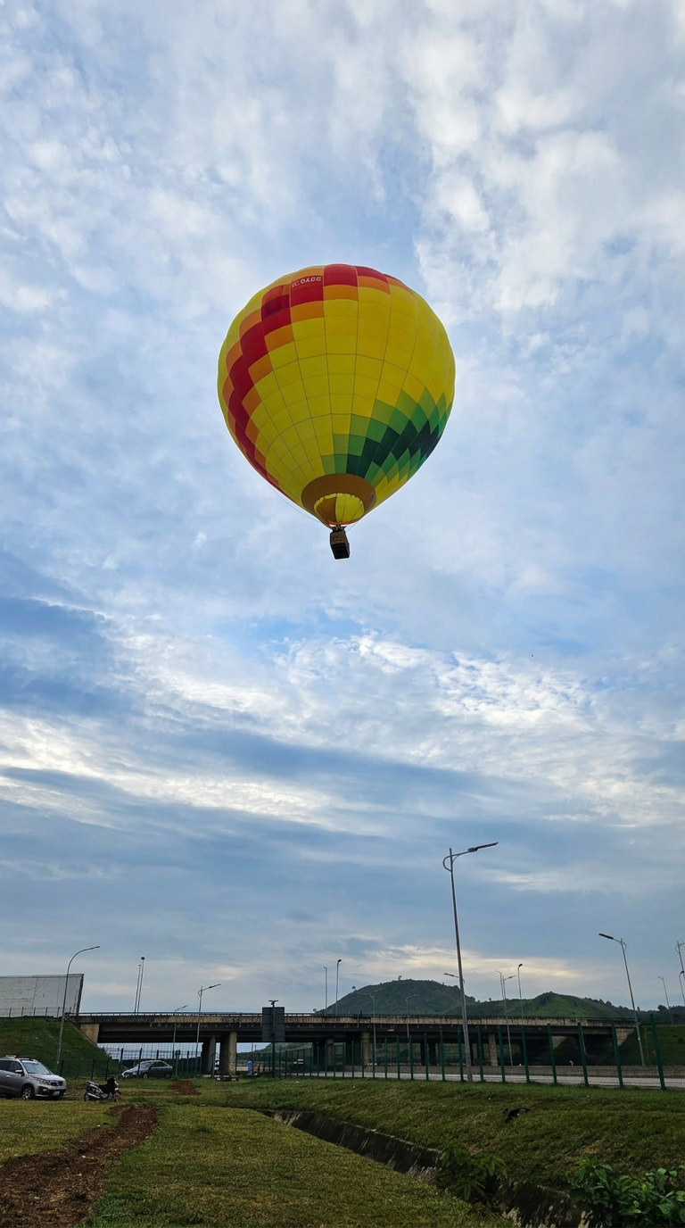 The Skytrek hot air balloon aloft over Abuja beneath a wide morning sky